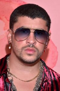 Bad Bunny performing on stage during SNL (Saturday Night Live) Season 51, showcasing his iconic energy