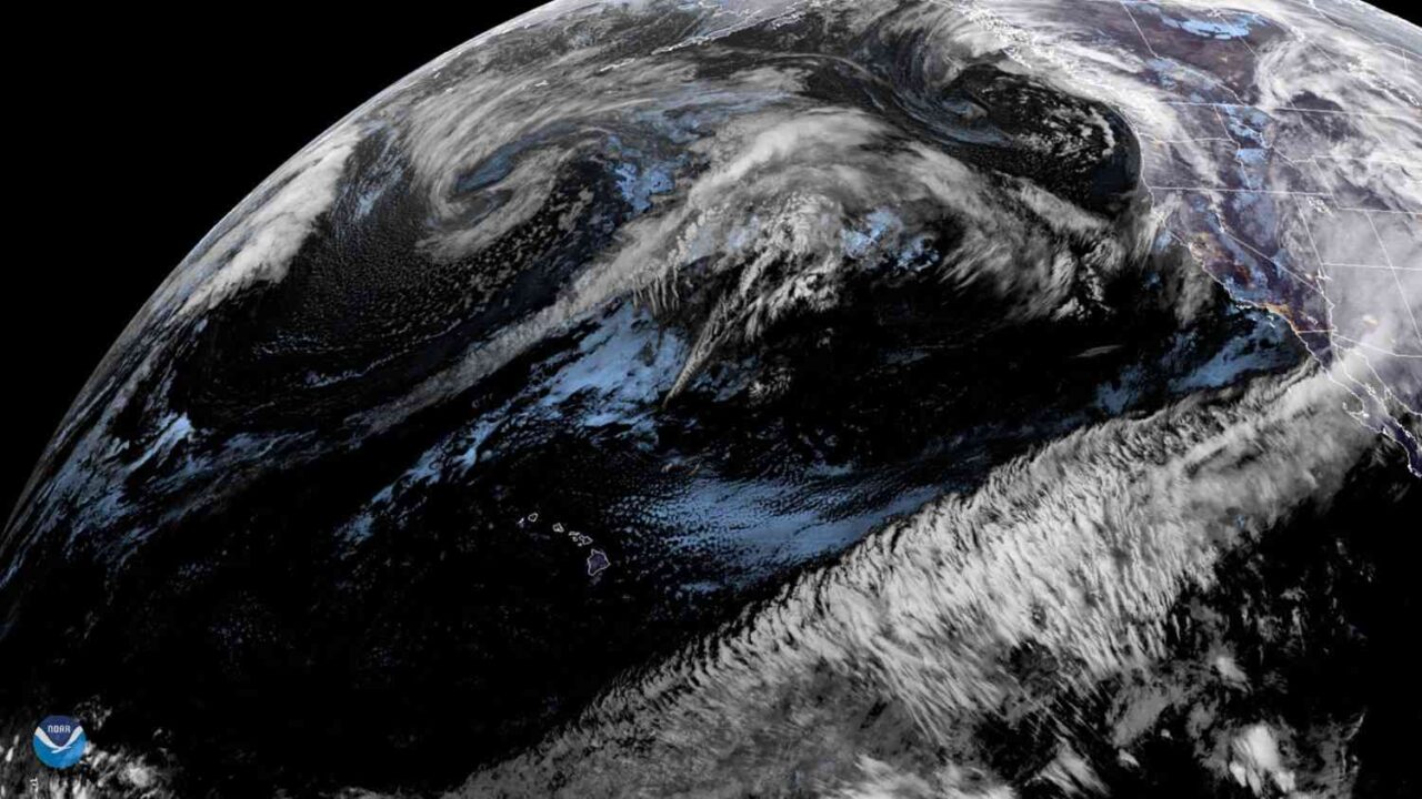 Satellite view of the Pineapple Express atmospheric river stretching from the central Pacific toward the U.S. West Coast, carrying a plume of tropical moisture that may cause heavy rain and flooding in California.