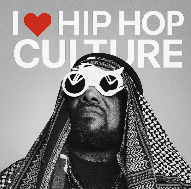 Black and white portrait of Afrika Bambaataa wearing unique sunglasses with text “I love hip hop culture” in the background