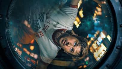 Ryan Gosling as Ryland Grace floating inside spacecraft window in Project Hail Mary movie scene